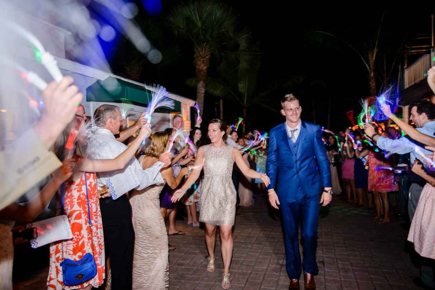 couple walking through glow stick grand exite=