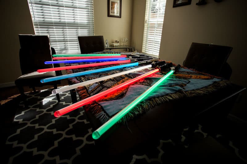 lightsabers laying on desk for Star Wars wedding