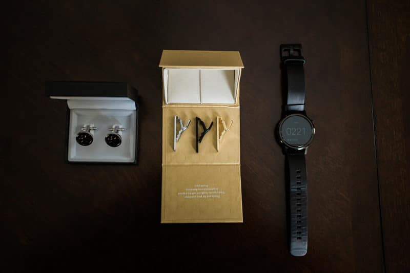 groom's wedding cuff links, tie clip, and watch