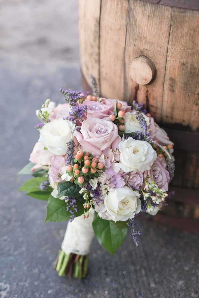 lavender and white rose bridal bouquet on barrel