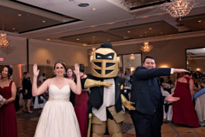 bride and groom with UCF mascot Knightro