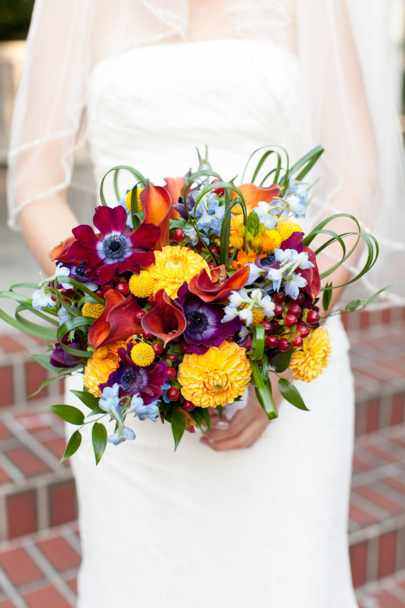 yellow mums and red anemone bridal bouquet