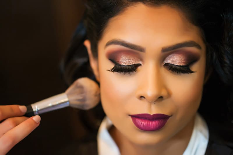 bride getting makeup done