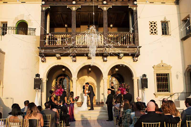 couple having first kiss in front of Powel Crosley Estate