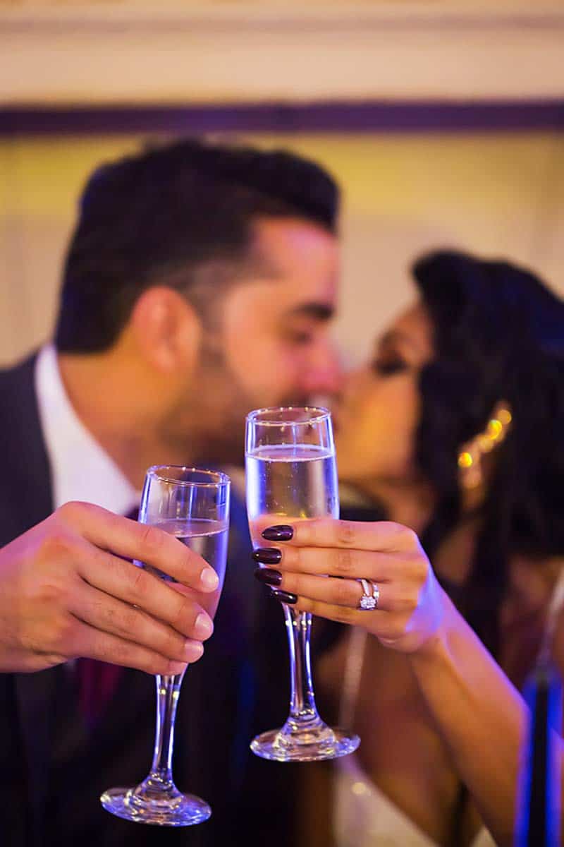 bride and groom toasting 