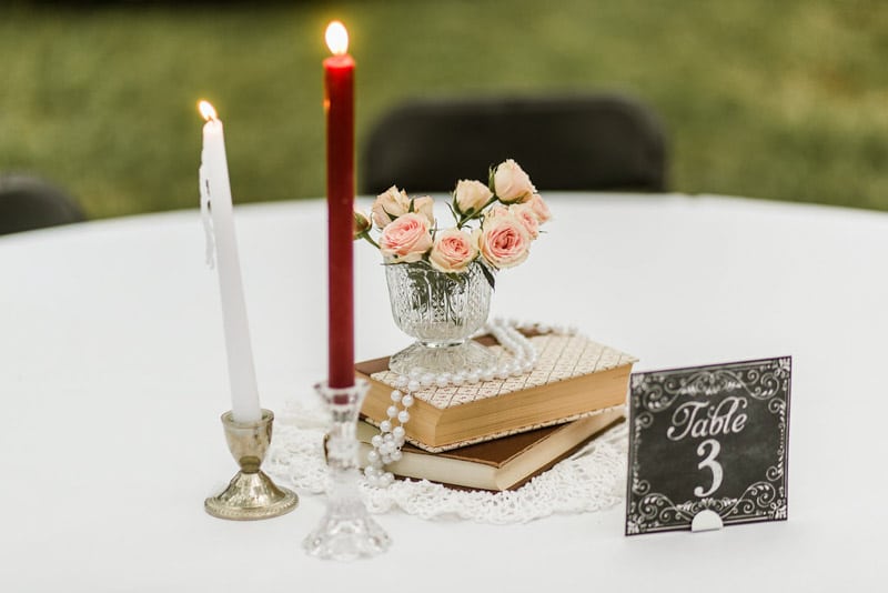 vintage books and candles for Mote-Morris House wedding centerpieces