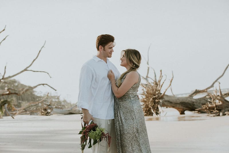couple looking at each other on the beach