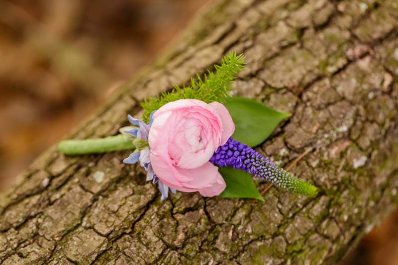 pink and purple boutonniere for starry night elopement 