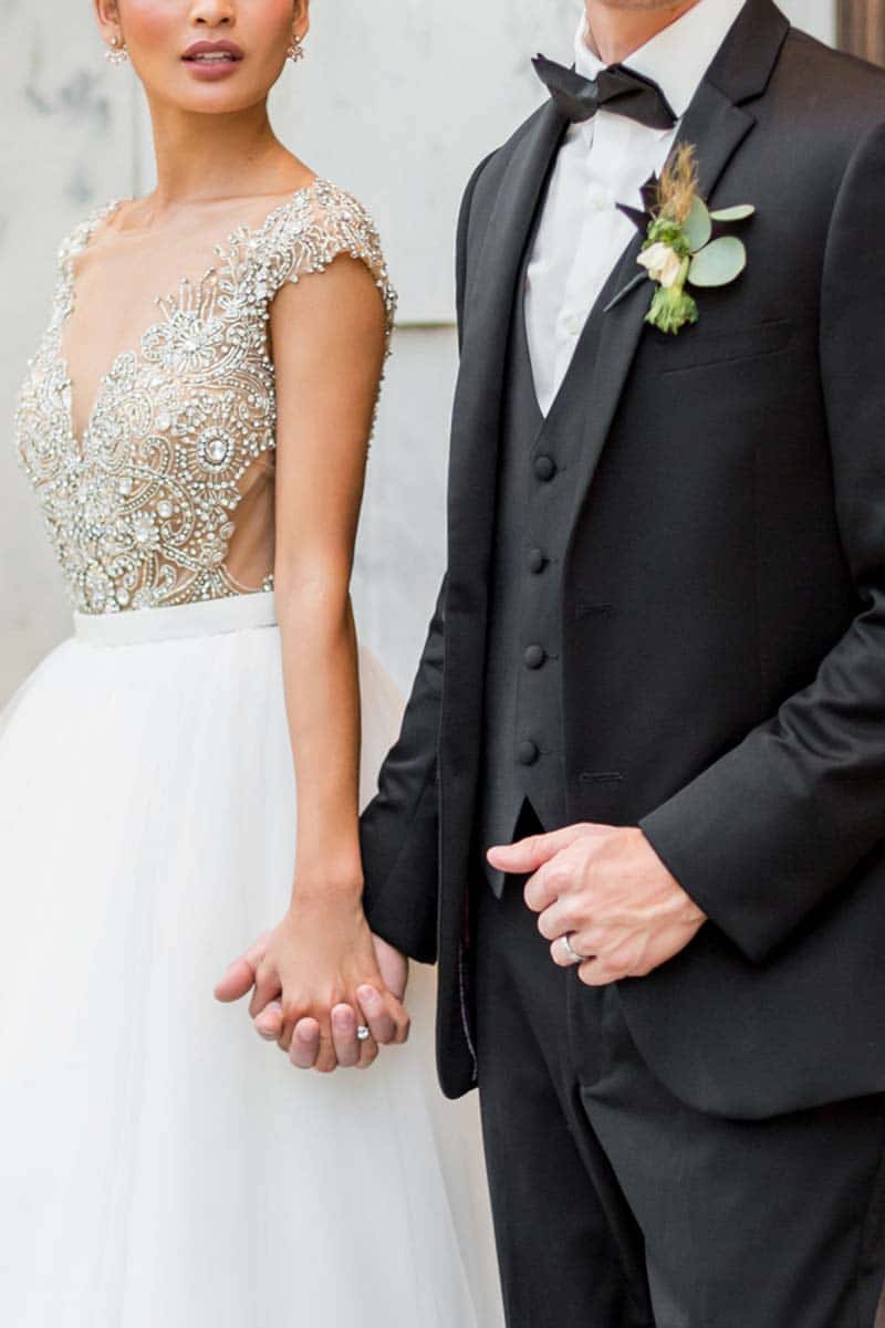 bride and groom holding hands
