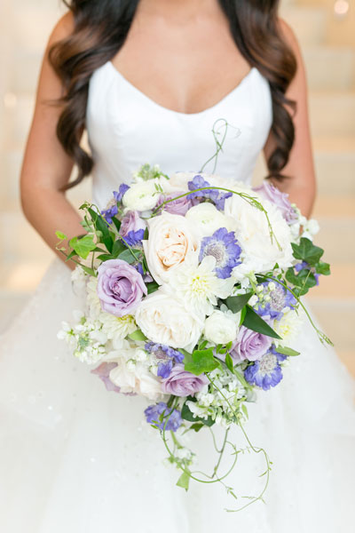 white and purple roses with cascading ivy for bridal bouquet