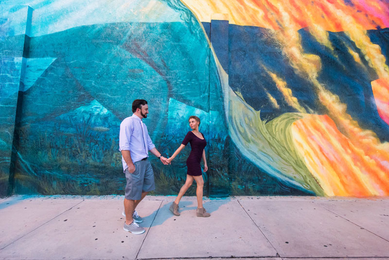 Couple walking in front of Florida Tech wall mural