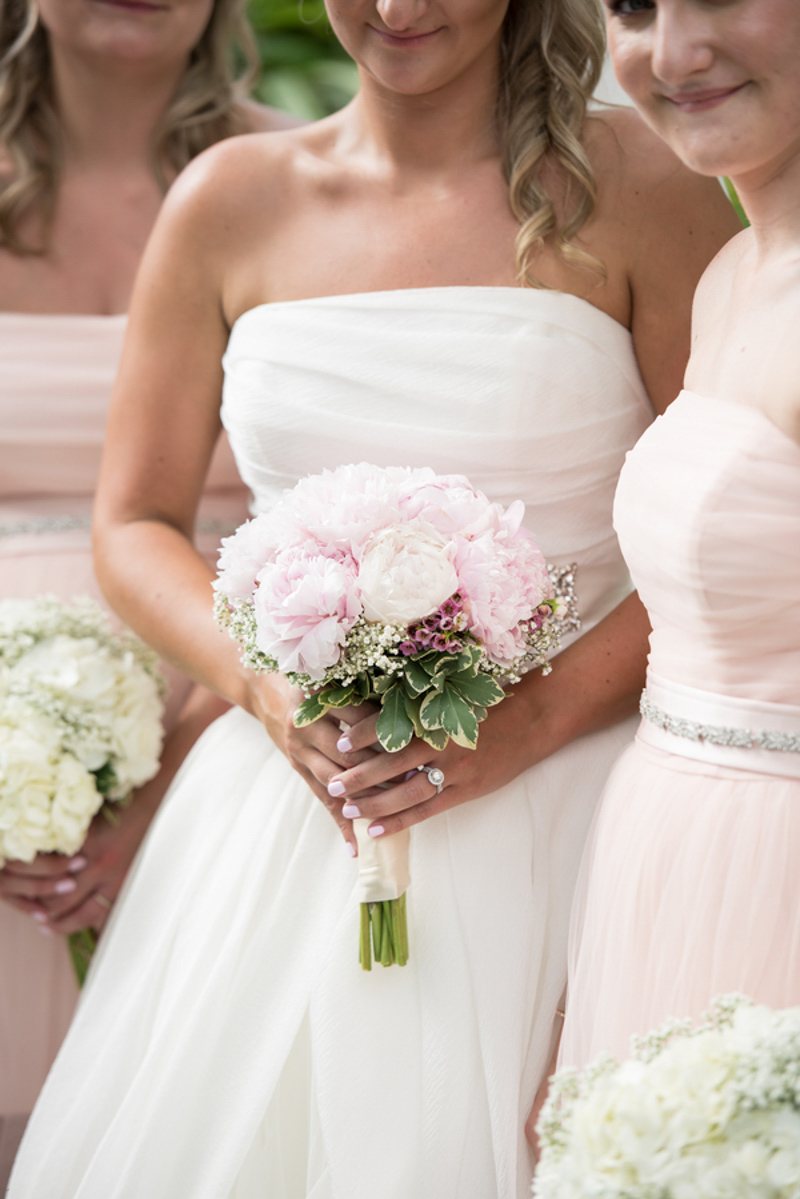 bride holding blush and white peony bridal bouquet