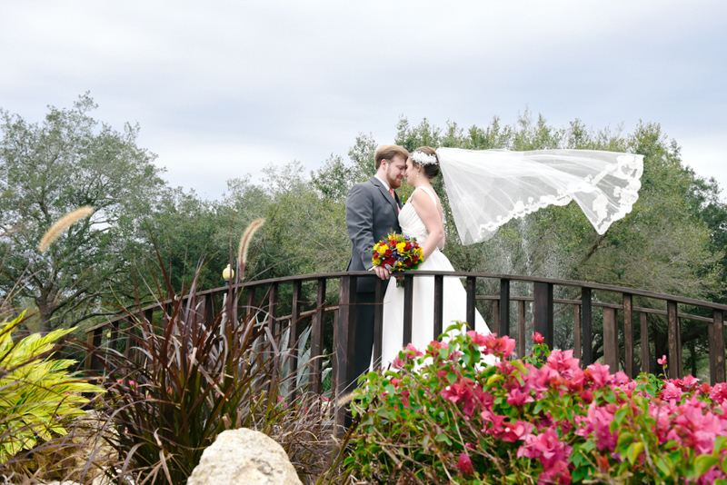 Couple on bridge at Mystic Dunes Resort and Golf Club