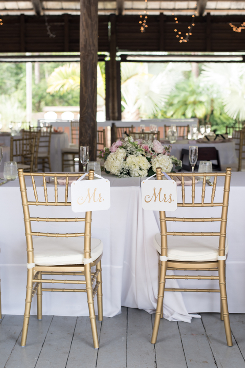 gold mr and mrs signs on gold chiavari chairs