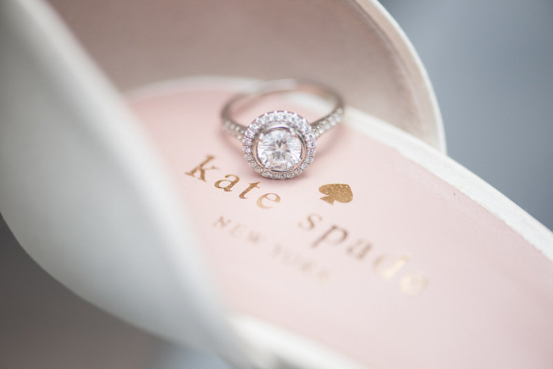 halo engagement ring on Kate Spade shoe
