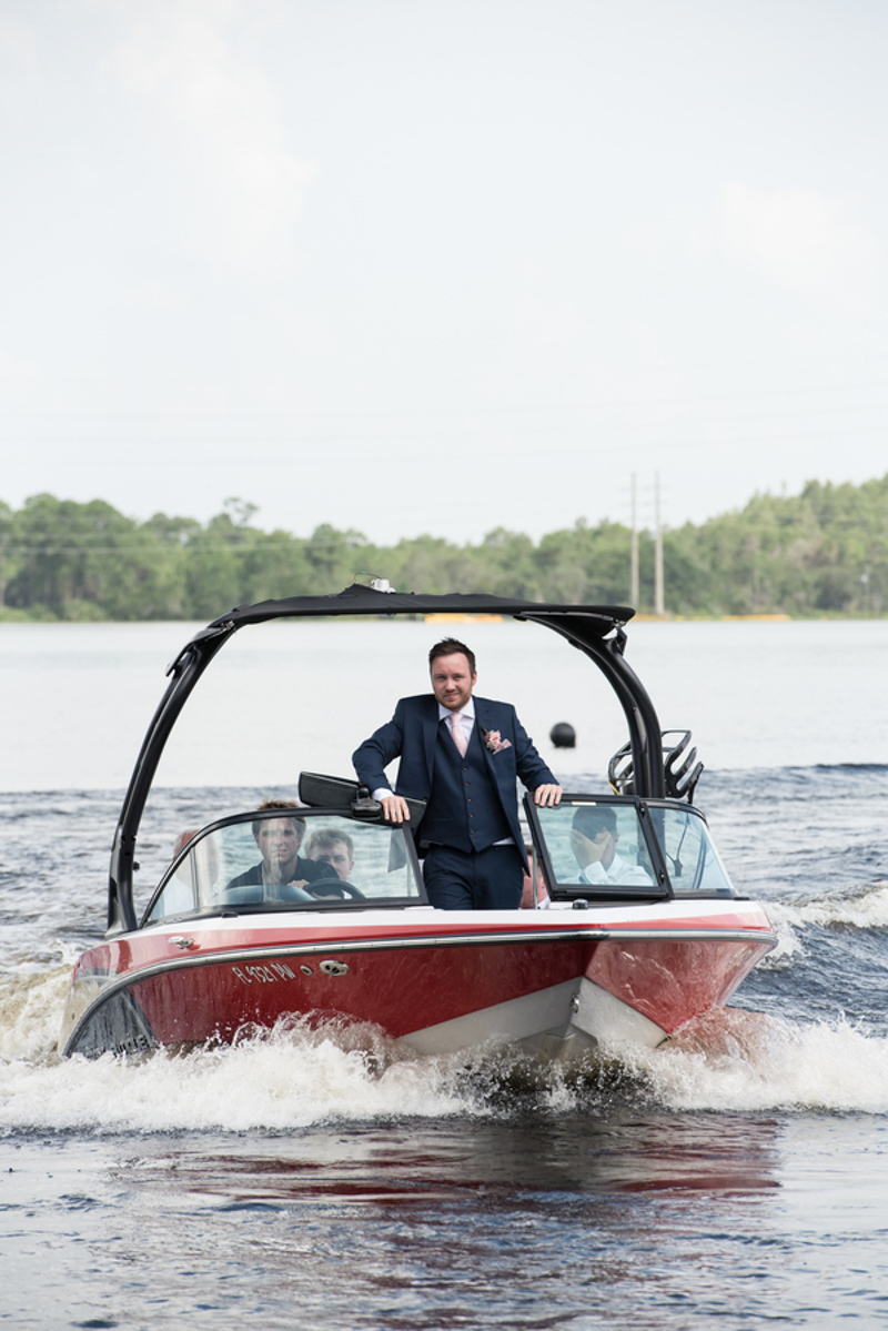 groom in speed boat coming to wedding ceremony