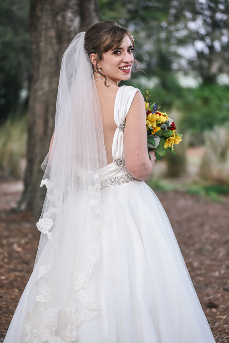 bride in Allure Bridal Gown looking over her shoulder