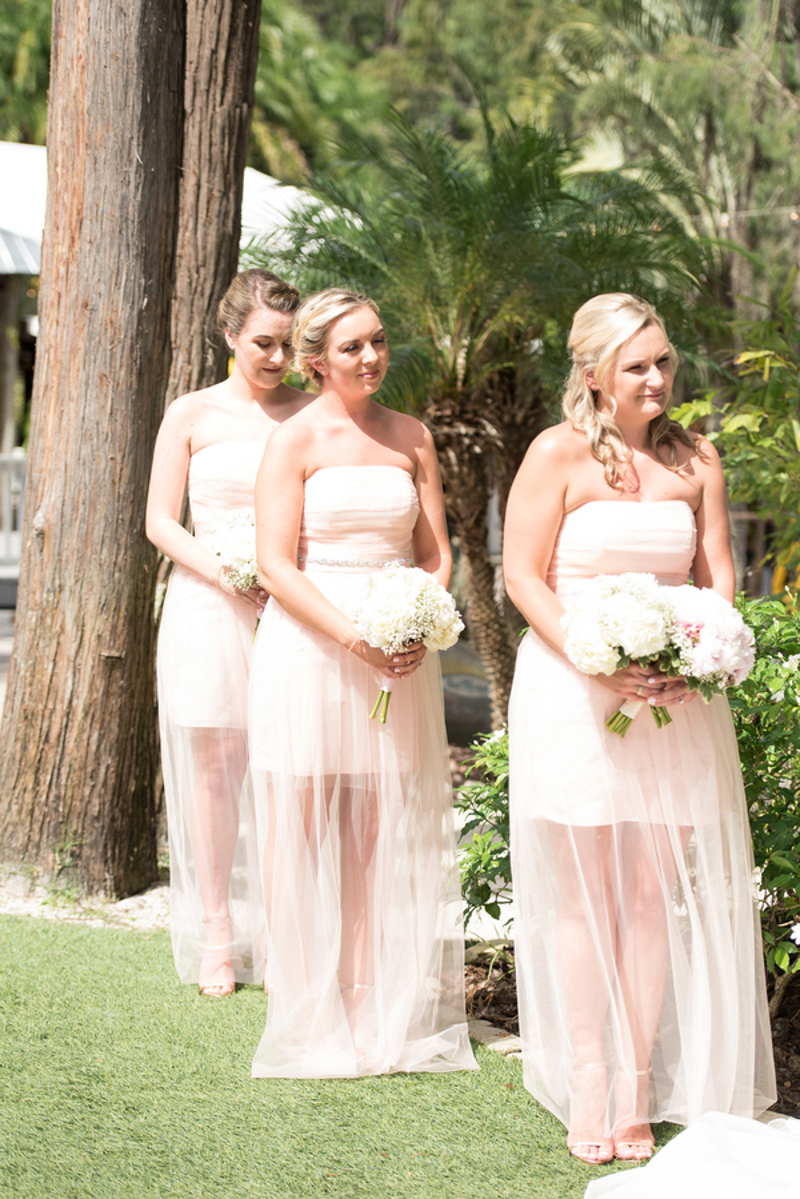 bridesmaids in short blush dresses