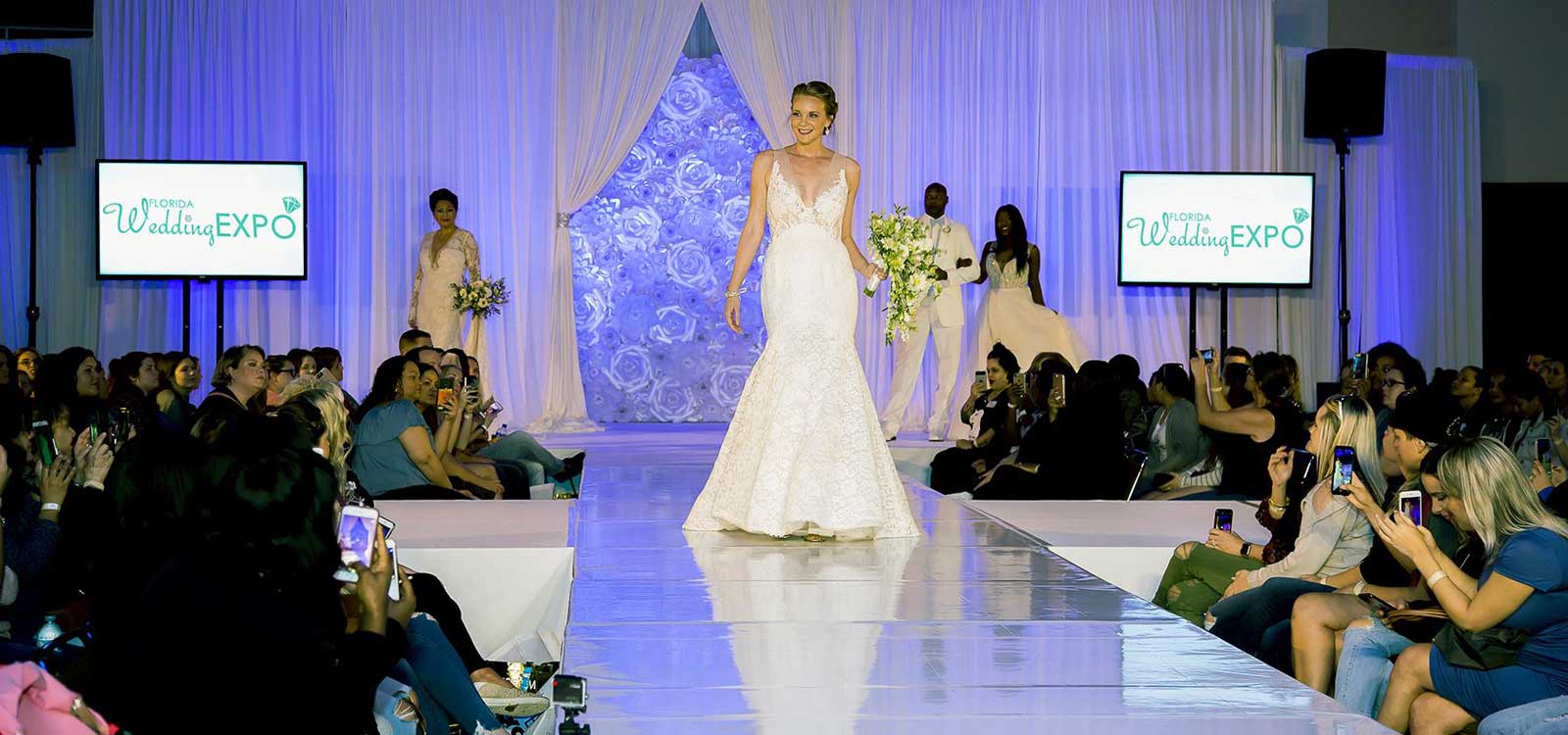 Model walking down runway in wedding dress at the Florida Wedding Expo wedding show