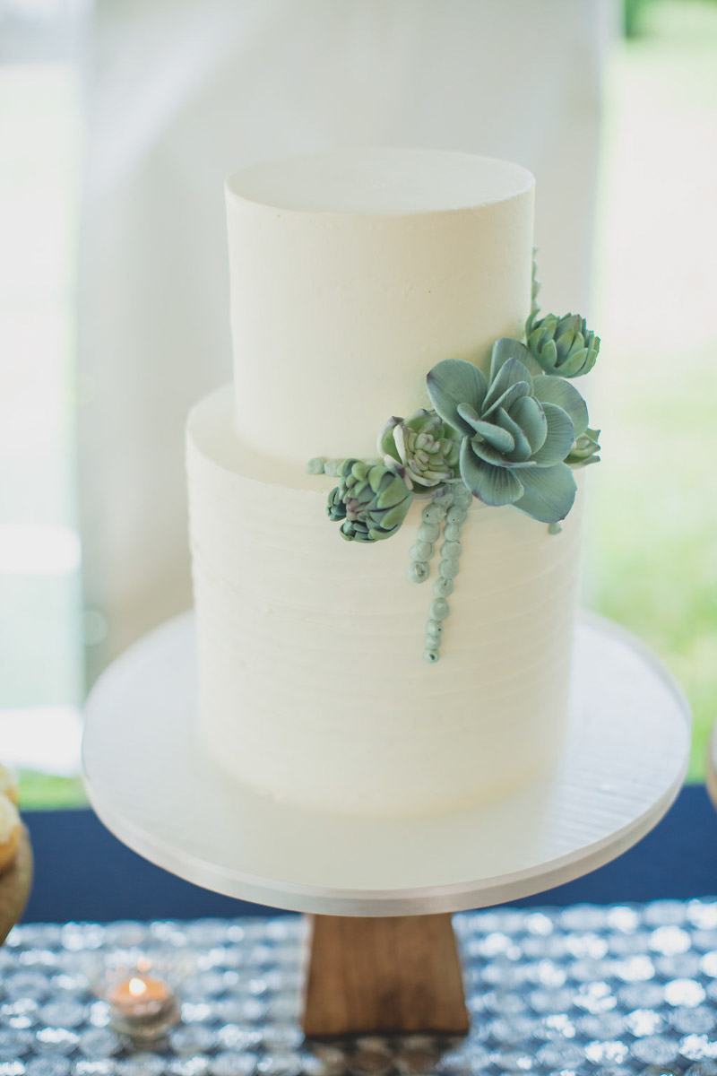 white buttercream wedding cake with succulent details