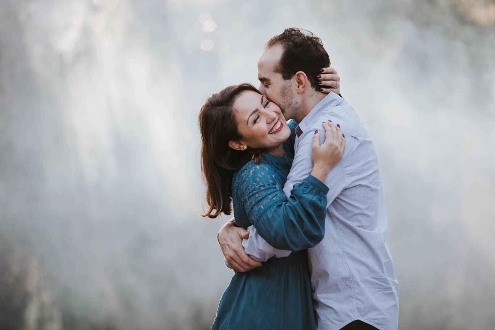 couple holding each each for engagement session