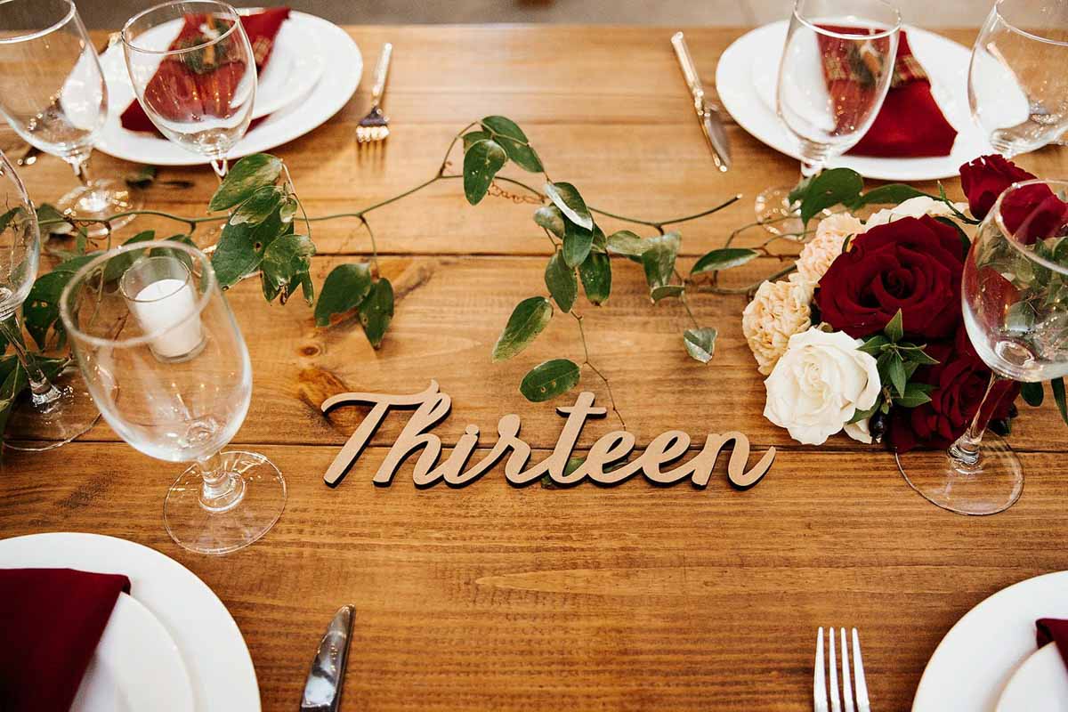 wooden number number on farm table at Christmas inspired wedding