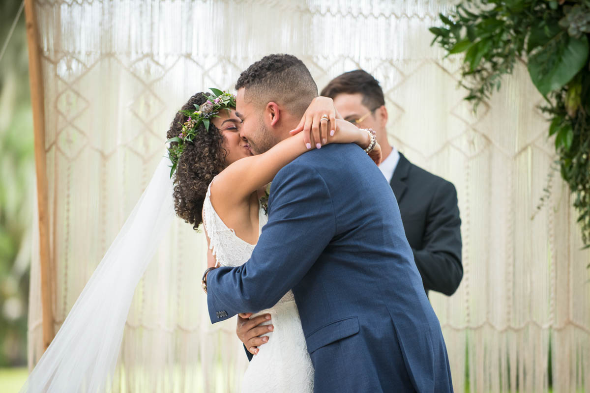 bride and groom's first kiss for wedding