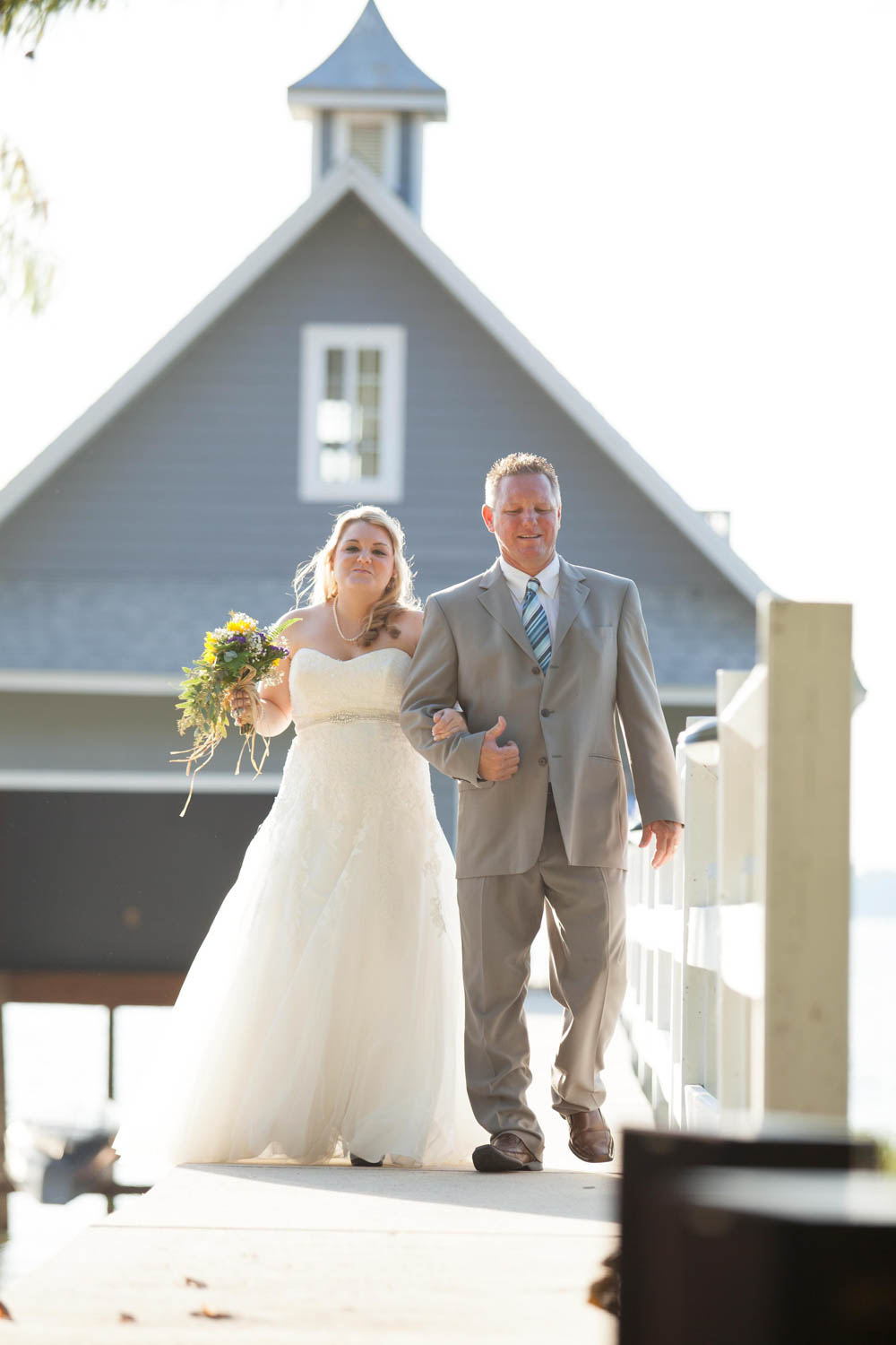 father walking bride of dock for wedding at Swor Cottage