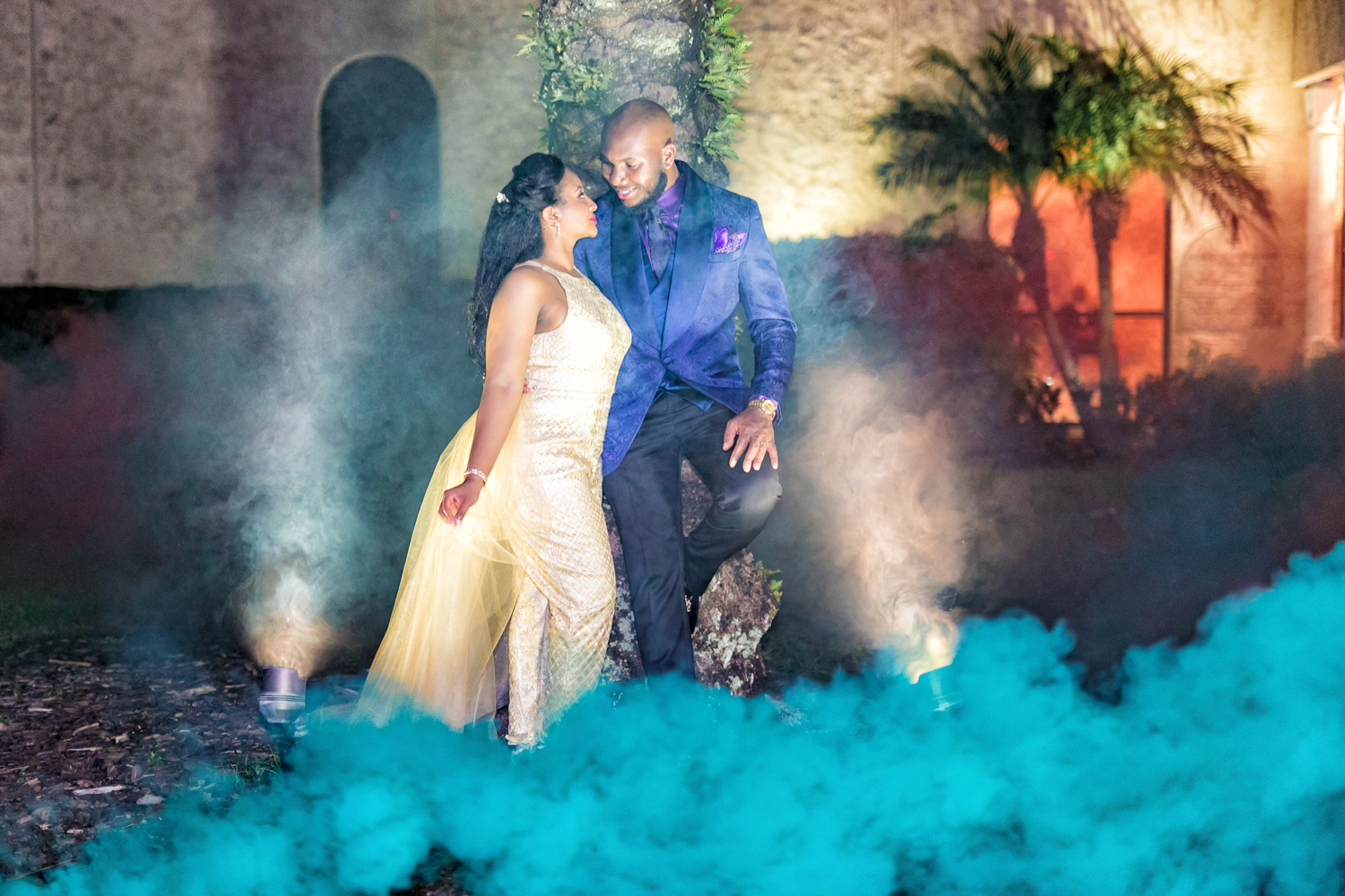 Smoke bomb picture of a bride and groom on their wedding day.