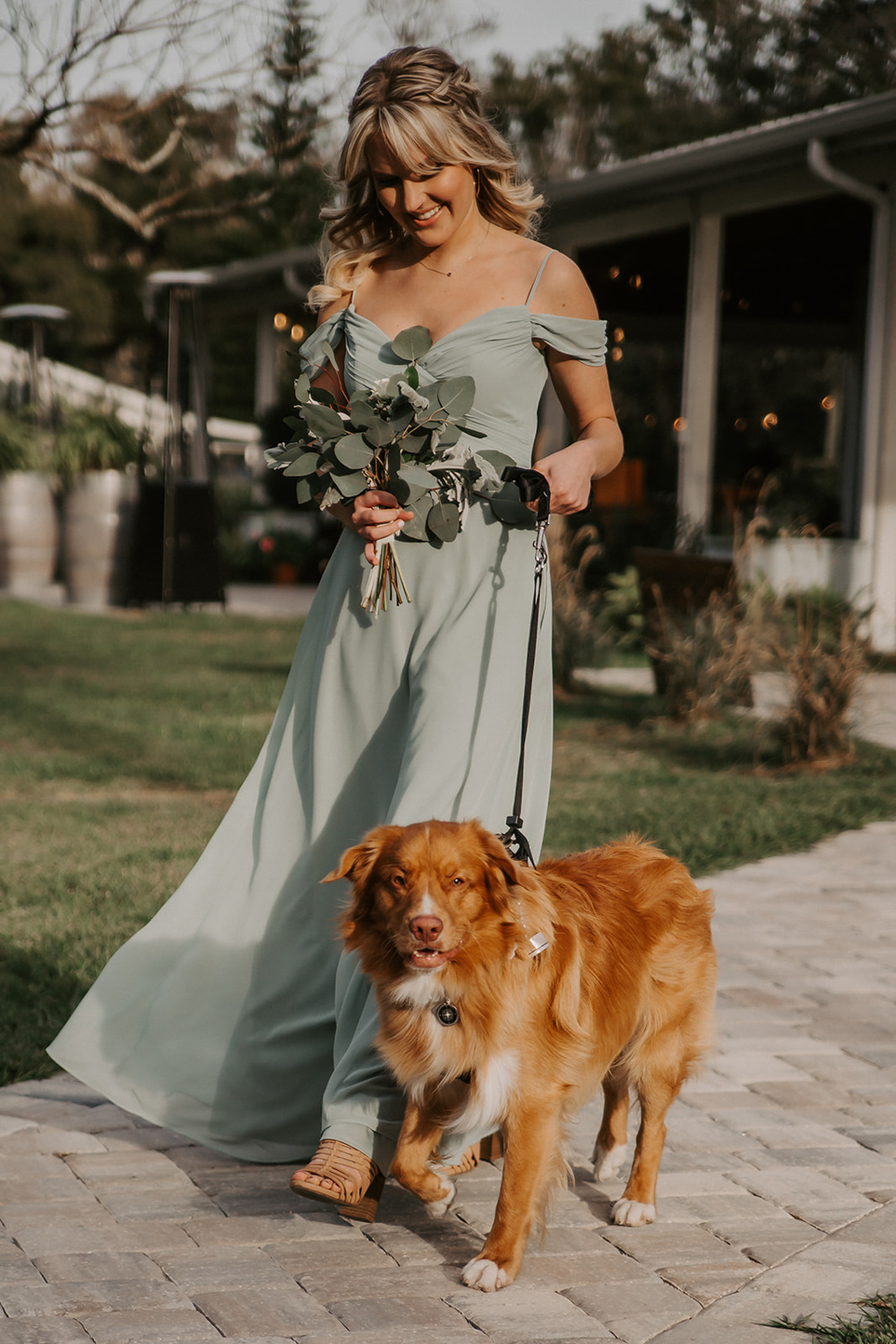 bridesmaids walking with dog for wedding ceremony