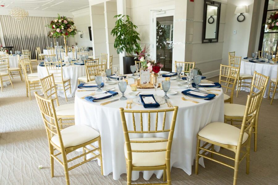round reception table with gold chivari chairs at Lake Nona Country Club
