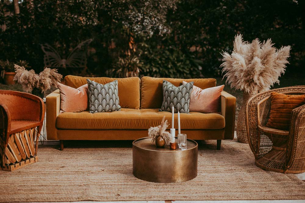 mustand sofa and pampas grass for wedding lounge area